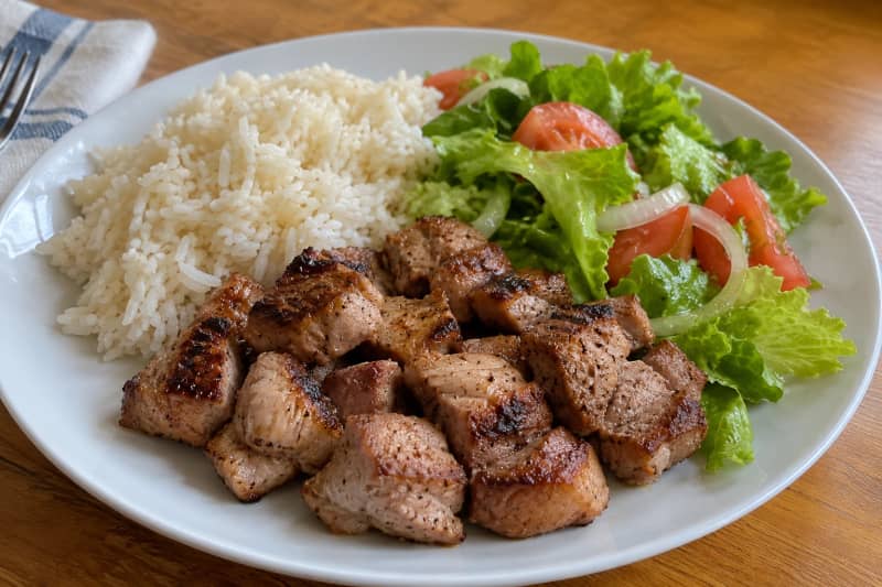 Grilled pork with rice and salad