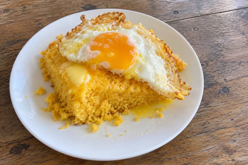 Cuscuz nordestino (steamed corn couscous) with egg