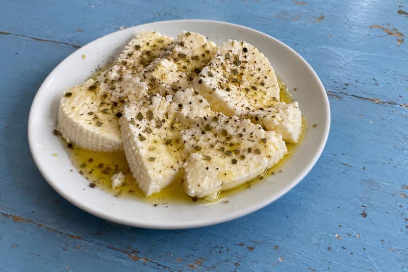 Fresh cheese with oregano and olive oil
