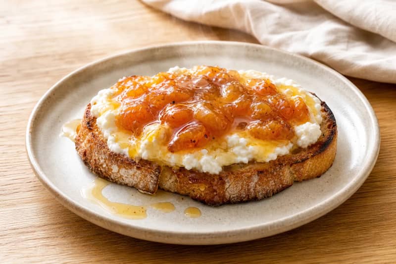 Toasts with fresh cheese and fruit jam